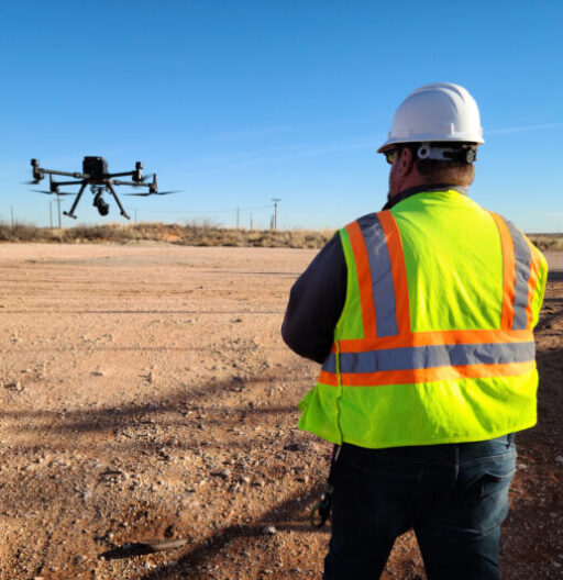 A man launching a methane leak detection drone with a remote control.
