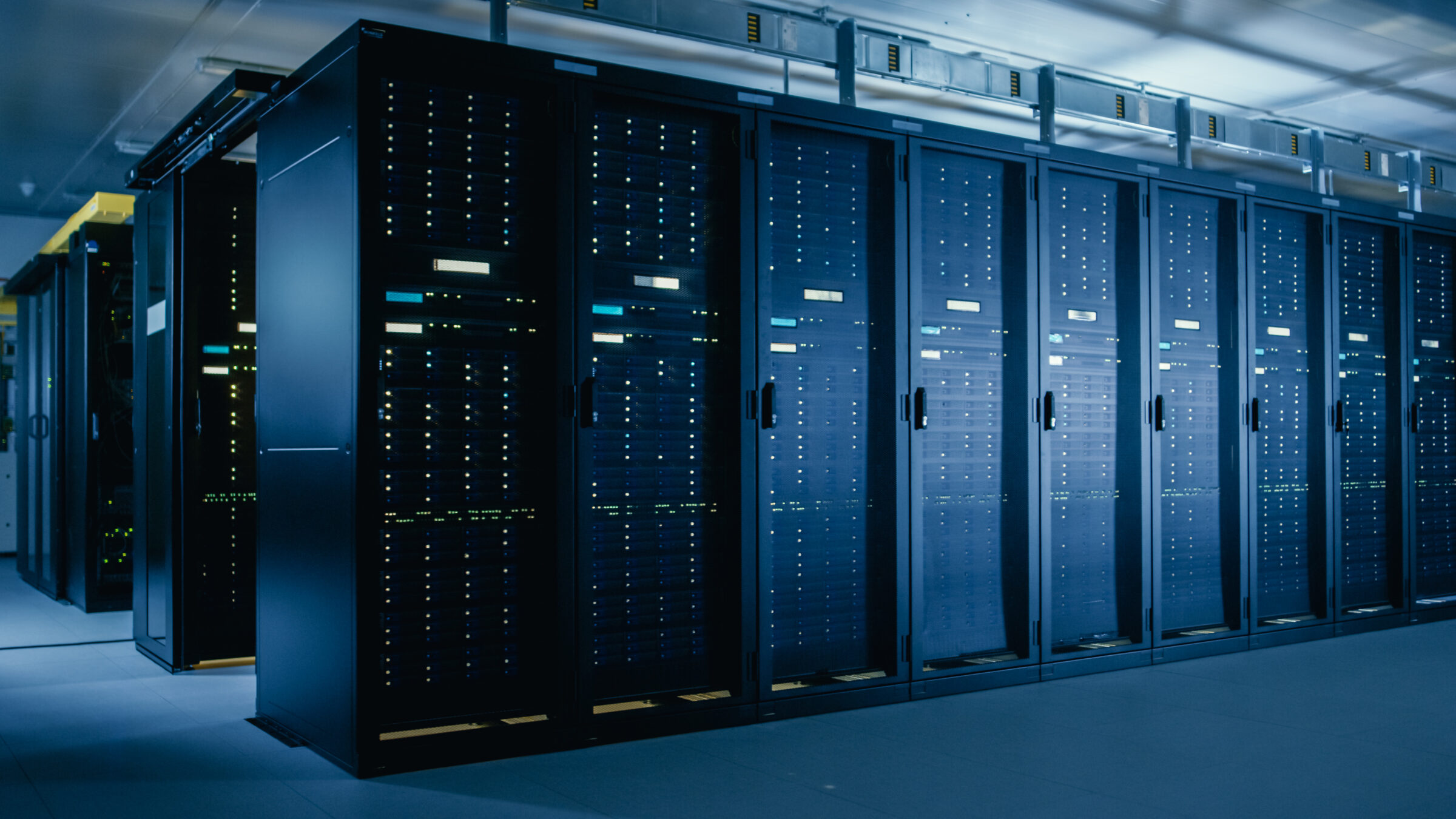 Shot of Data Center With Multiple Rows of Fully Operational Server Racks