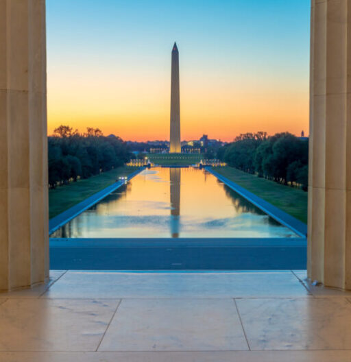 Sunrise view of the Washington Monument obelisk with the reflecting pool as seen from the Lincoln Memorial.