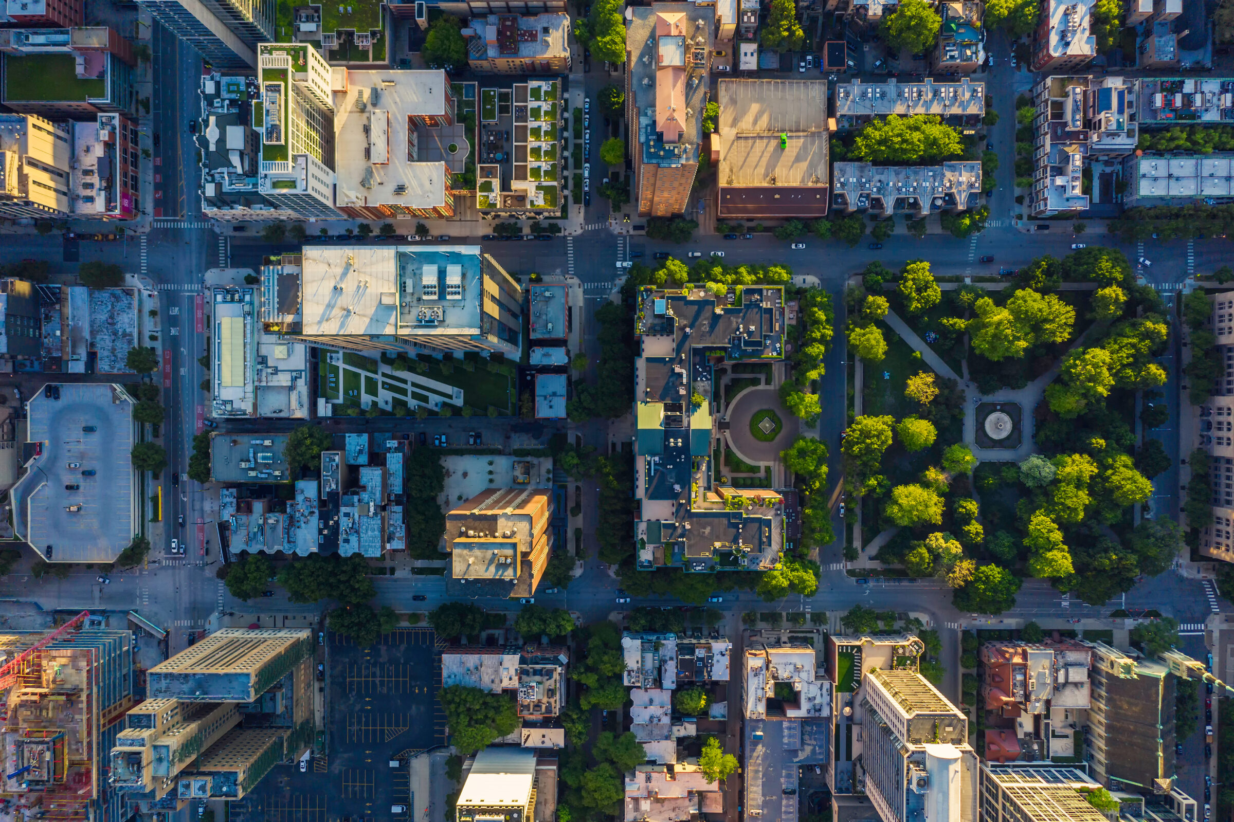 Aerial view of Chicago Downtown rooftops and urban grid with a park. Late afternoon light.