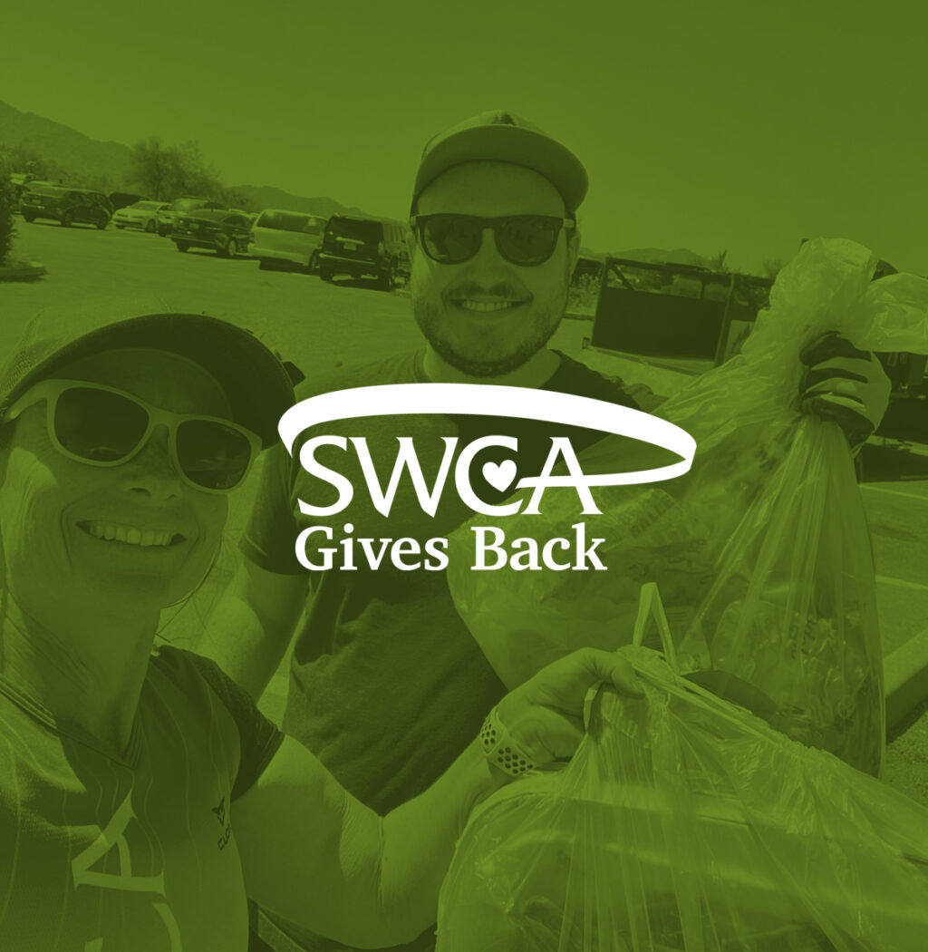 SWCA Gives Back tinted photo of people holding bags of goods