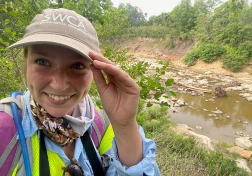 Field worker selfie from a creekside
