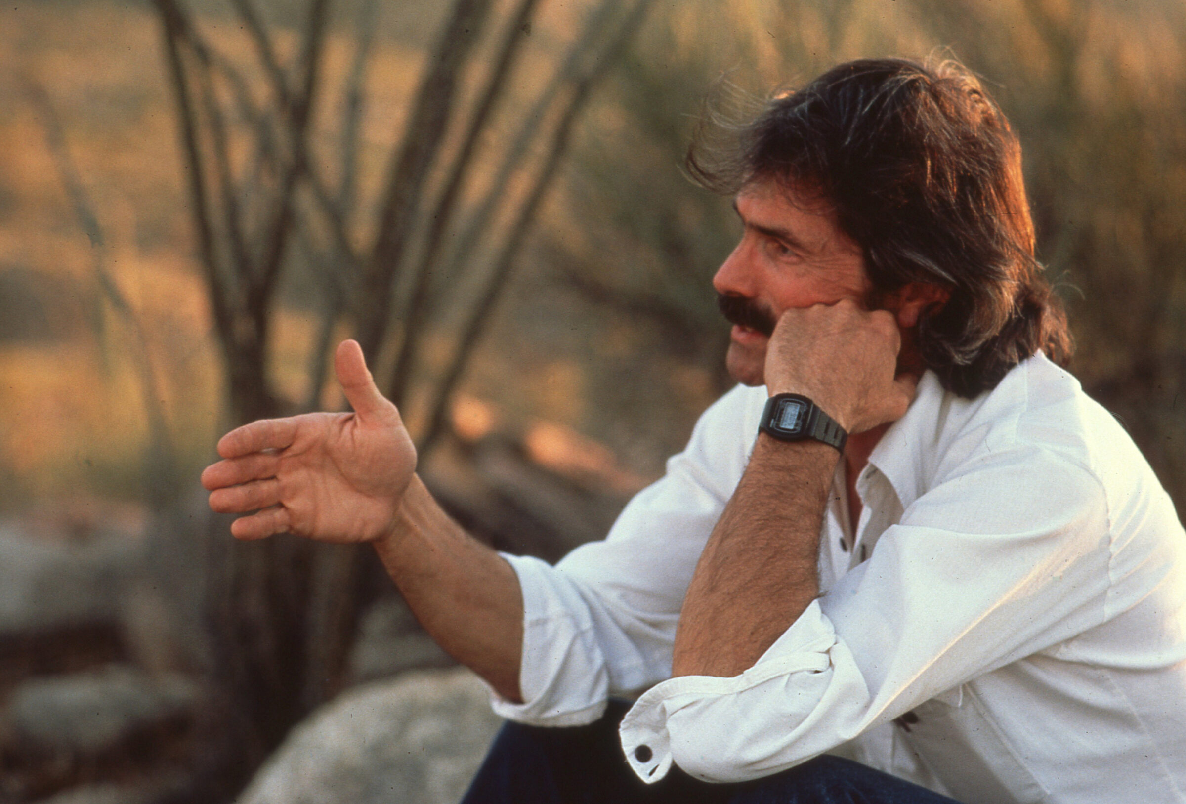 Historical photo of Steven Carouthers in conversation.