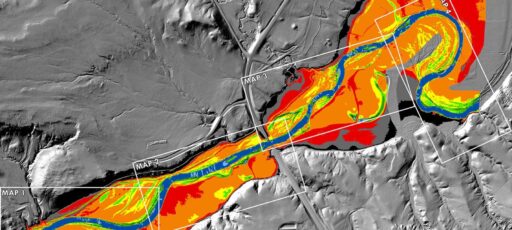 Satellite imagery of a river, with orange and red elevation color ramp markings.
